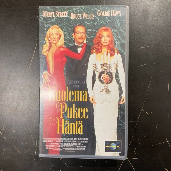 Kuolema pukee häntä VHS (VG+/M-) -komedia/fantasia-